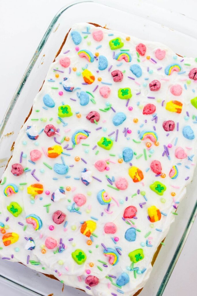 overhead shot of 9x13 lucky charms cake in pan