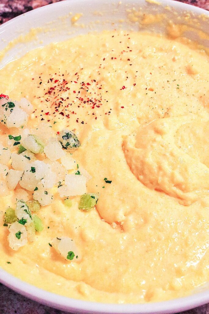 wet cornmeal hush puppy batter in a large bowl