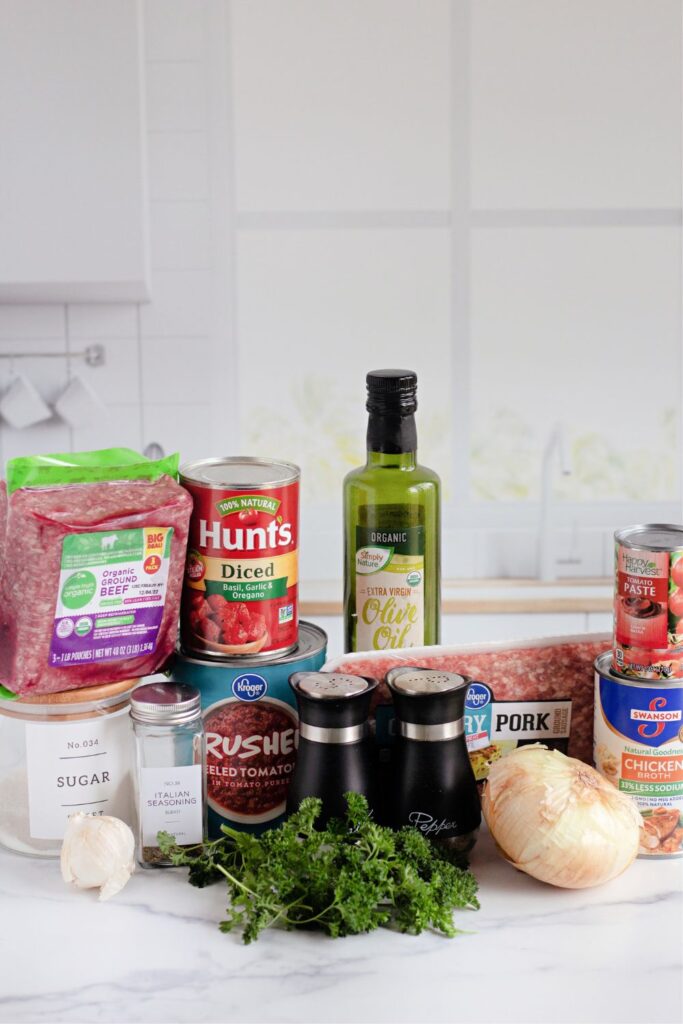 ingredients for homemade meat sauce on a kitchen counter