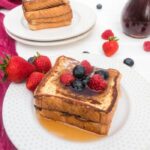 white plate with stack of french toast