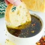 Bread Dipping Oil with a piece of bread soaking in oil