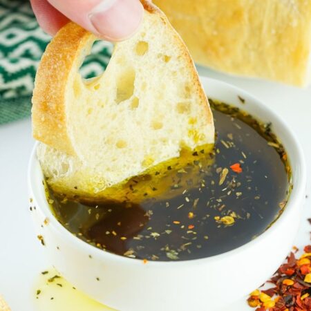 Bread Dipping Oil with a piece of bread soaking in oil