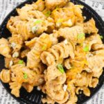 Buffalo Chicken Pasta on a black plate on a table