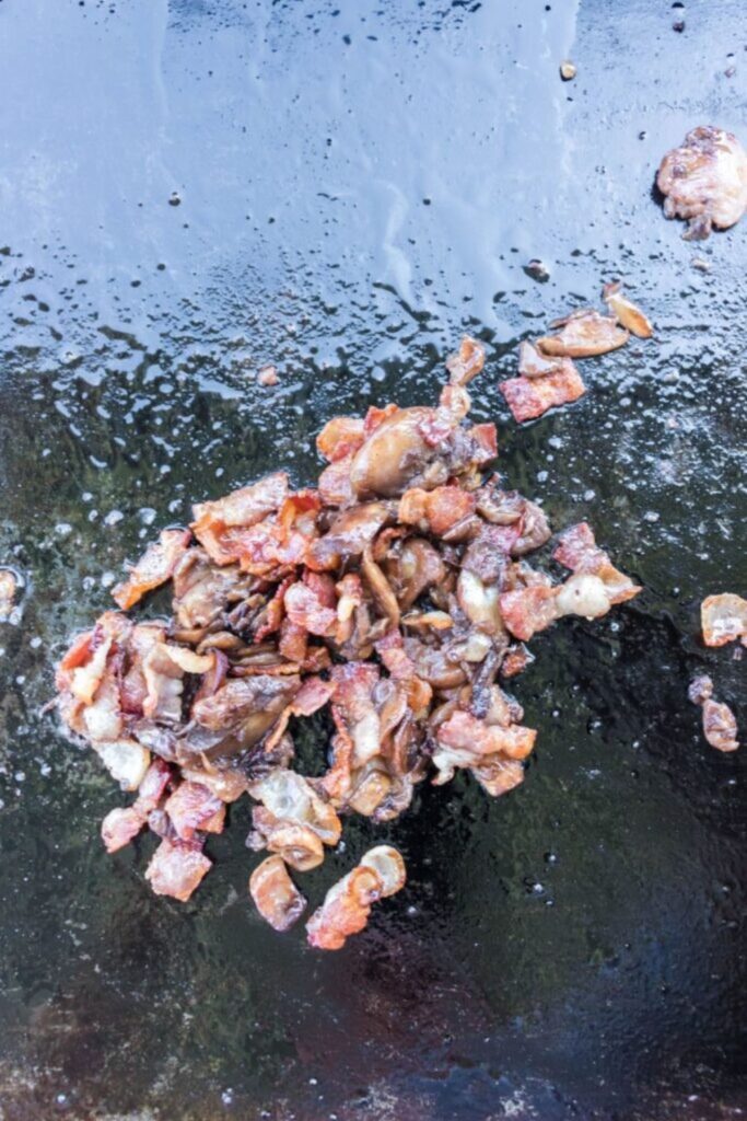 cooked diced bacon on a blackstone
