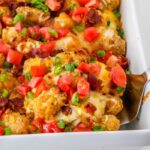 side view of a chicken tater tot casserole in pan