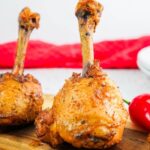 close up of chicken lollipop on cutting board