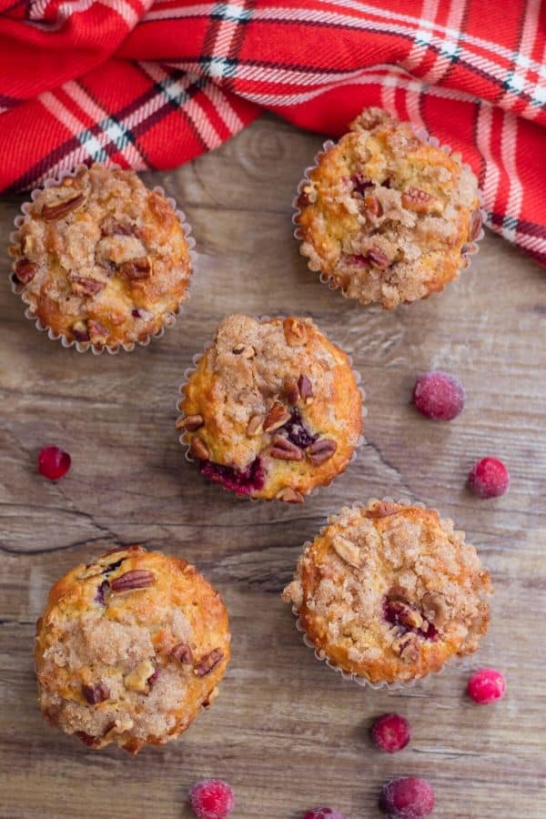 Cranberry muffins are a delicious winter muffin recipe. Cranberry muffins with a walnut streusel topping. Bake up and freeze for breakfast on the go. #cranberry #frozen #freezerfriendly #muffins #holiday #christmas #recipe #dessert #streusel #walnut #oatmeal #best #easy christmas muffins