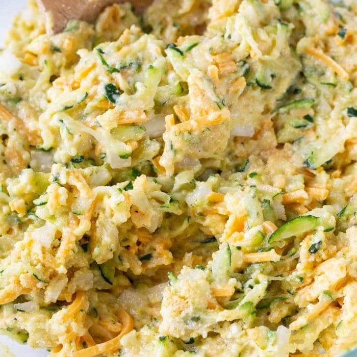 cornbread batter mixed in in a glass bowl on table