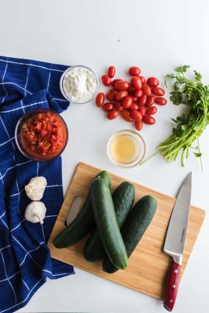 Zesty Fresh Cucumber Salad ingredients on table spread out