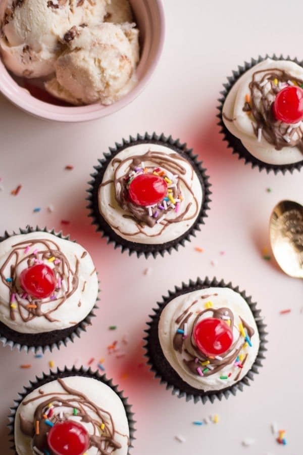 cupcakes for parties on counter with ice cream behind it