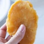 fried cod plank in hand