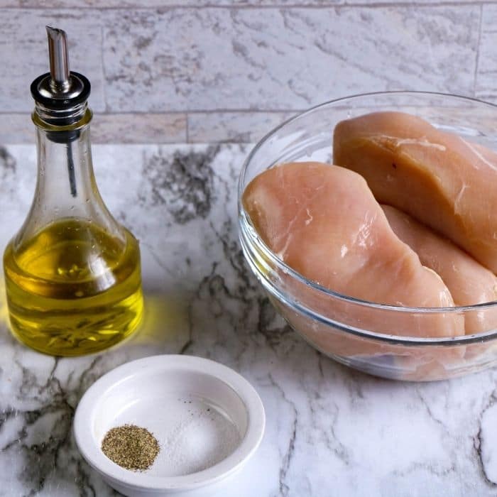 chicken, oil, and spices on table