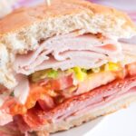grinder sandwich cut open on plate