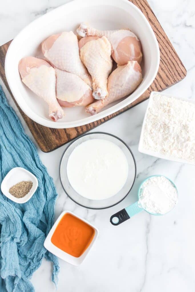 ingredients for homemade friend chicken on table in single serve containers