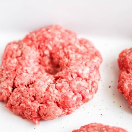raw hamburgers in casserole pan