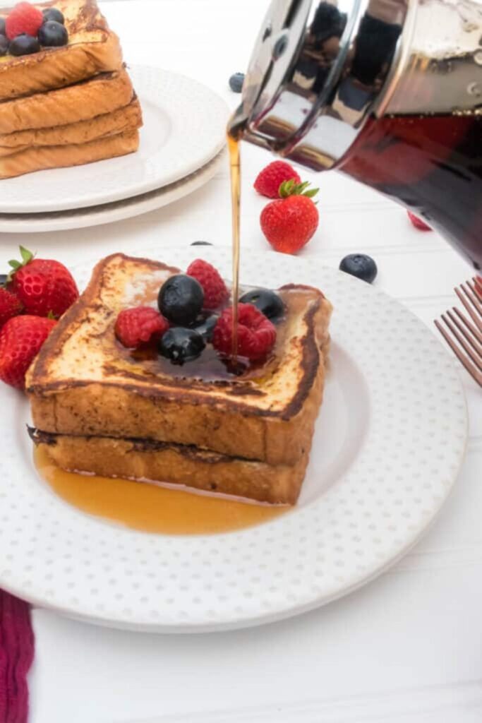 pouring syrup on french toast