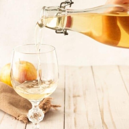 pouring alcohol into wine glass