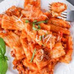 instant pot rigatoni on a plate with parmesan on top