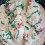 Marry Me Chicken in a pan with creamy sauce all over it