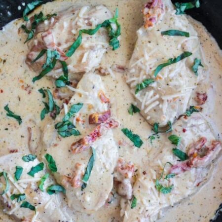 Marry Me Chicken in a pan with creamy sauce all over it