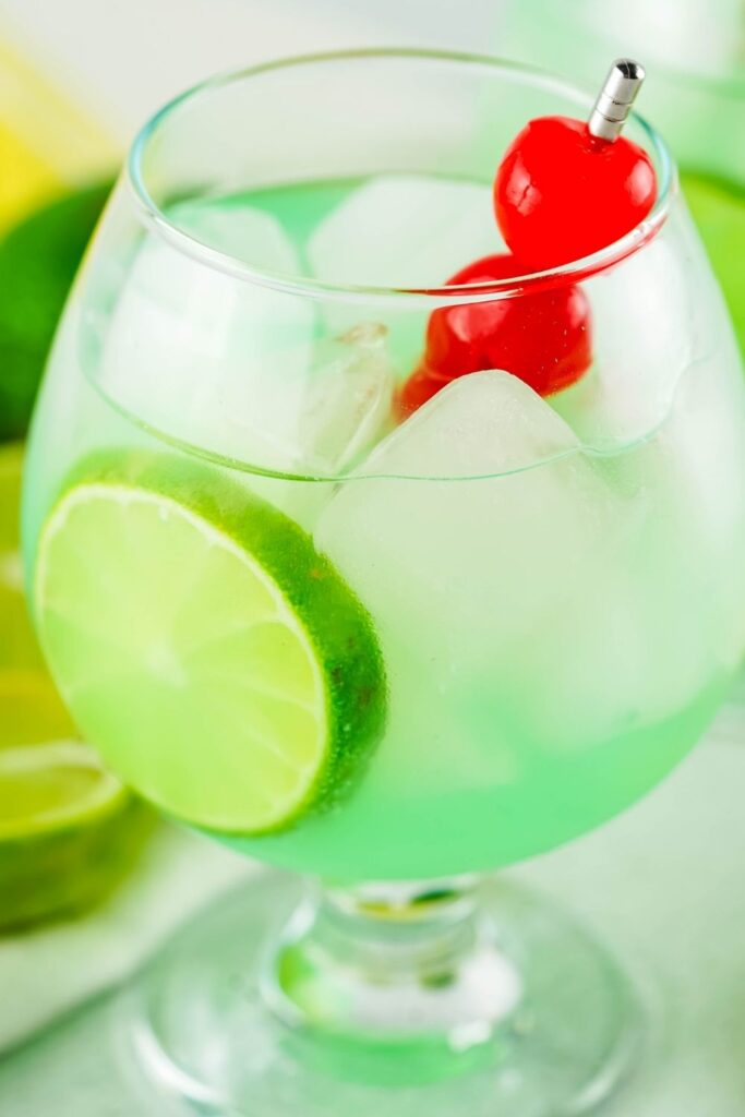 mermaid punch in glass with cherries on top