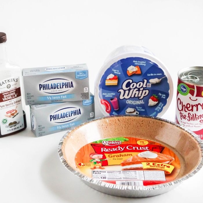 ingredients for no bake cheesecake on white table
