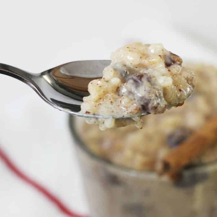 Instant Pot Rice Pudding is the BEST and easiest rice pudding recipe ever. Thick and creamy rice pudding that is loaded with cinnamon and raisins in every bite. #rice #pudding #ricepudding #pressurecooker #InstantPot #whiterice #best #creamy #sweetenedcondensedmilk #dessert #holiday #winter #foodblogger pressure cooker rice pudding