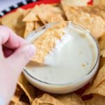 chip dipping in queso blanco