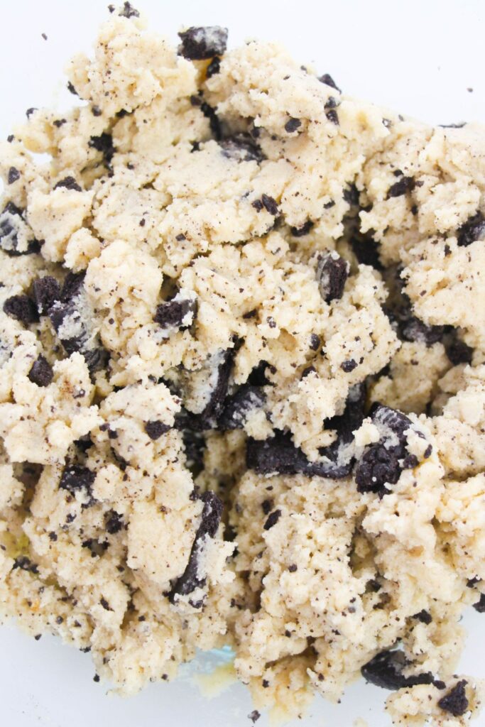 raw cookie dough mixed together in a clear bowl