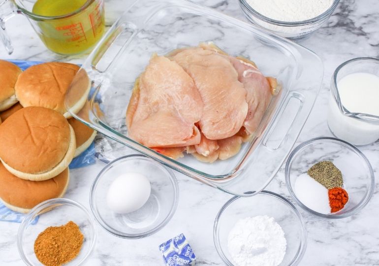 ingredients for deluxe chicken sandwich on marble counter