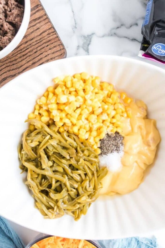 corn, green beans, and cream of chicken soup in a bowl on table