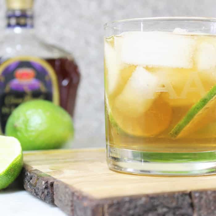 Whiskey and Ginger Ale with a splash of lime is one refreshing adult beverage to whip up in a hurry. Light, refreshing, and bursting with fresh flavors. #crownroyal #whiskey #cocktail #ginger #gingerale #freshlime #recipe #boozy #summercocktail whiskey ginger