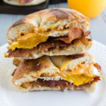 Blackstone Bacon Egg and Cheese Sandwich cut in half on a plate